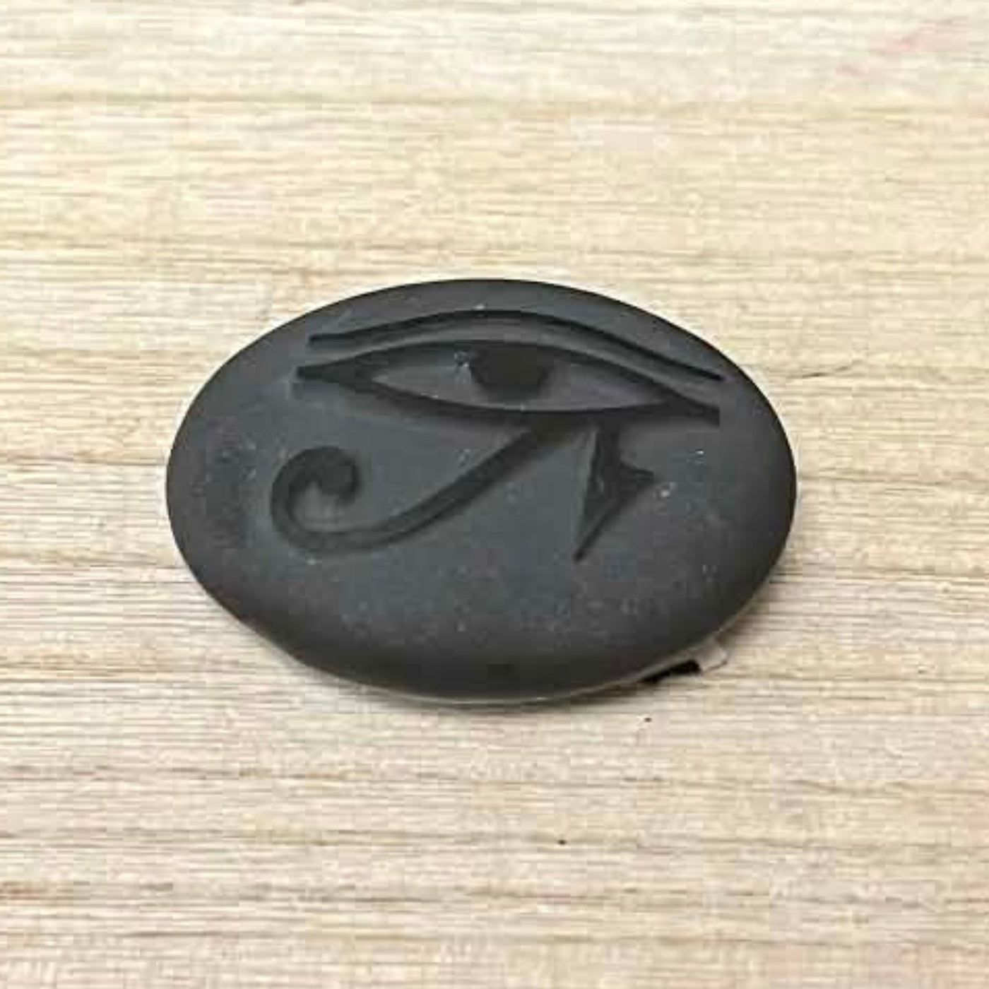 Shungite - 2.5" - Palm Stone with raised Eye of Horus